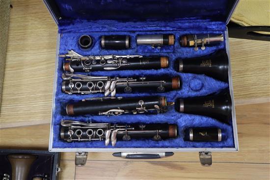 Four cased clarinets - two by Buffet and two by Boosey & Hawker